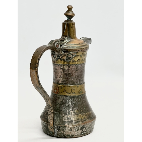 205 - A 18th/Early 19th Century Turkish silvered copper dallah coffee pot with engraved brass banding. 20x... 