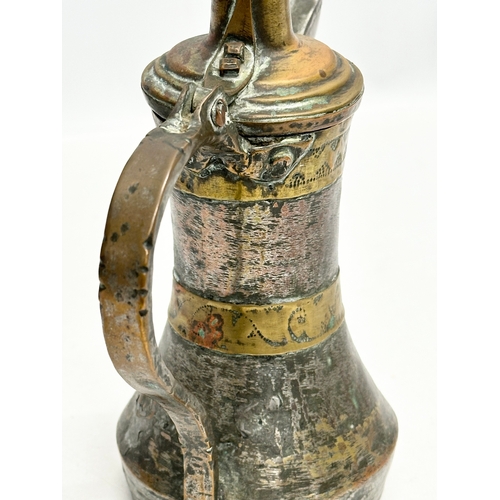 205 - A 18th/Early 19th Century Turkish silvered copper dallah coffee pot with engraved brass banding. 20x... 