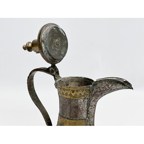 205 - A 18th/Early 19th Century Turkish silvered copper dallah coffee pot with engraved brass banding. 20x... 