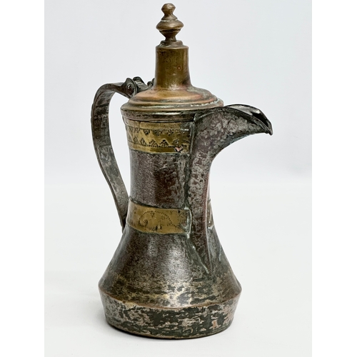 205 - A 18th/Early 19th Century Turkish silvered copper dallah coffee pot with engraved brass banding. 20x... 