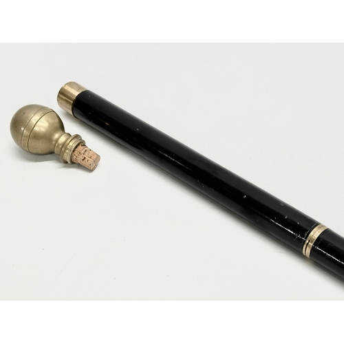 342 - An Early 20th Century gadget cane. 85.5cm