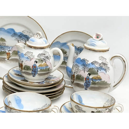 343 - A 37 piece signed Early 20th Century Japanese hand painted eggshell tea service. 2 tea cups not pict... 