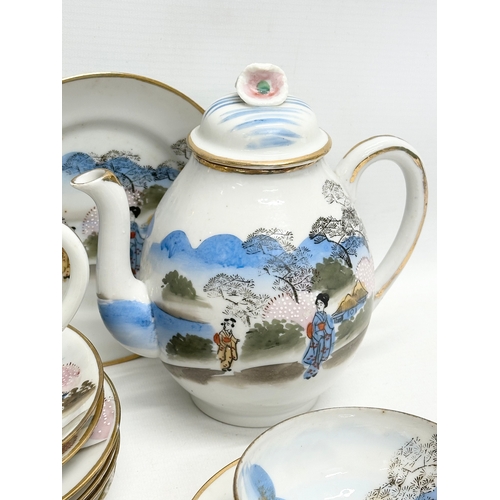 343 - A 37 piece signed Early 20th Century Japanese hand painted eggshell tea service. 2 tea cups not pict... 