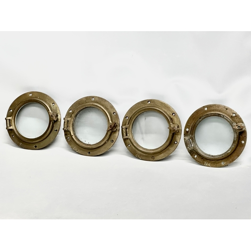 303 - 4 Early 20th Century brass ships portholes. Stamped S-L. Simpson Lawrence. 25cm