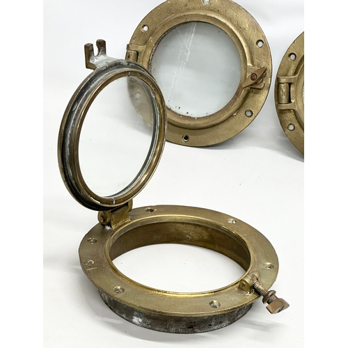 303 - 4 Early 20th Century brass ships portholes. Stamped S-L. Simpson Lawrence. 25cm