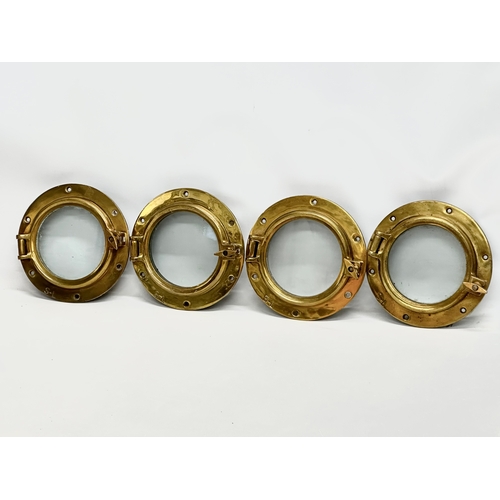 305 - 4 Early 20th Century brass ships portholes. Stamped S-L. Simpson Lawrence. 24cm