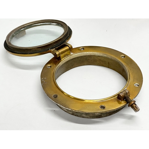 305 - 4 Early 20th Century brass ships portholes. Stamped S-L. Simpson Lawrence. 24cm