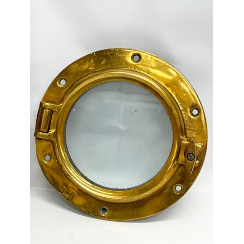 306 - 3 Early 20th Century brass ships portholes. Stamped S-L. Simpson Lawrence. 24cm