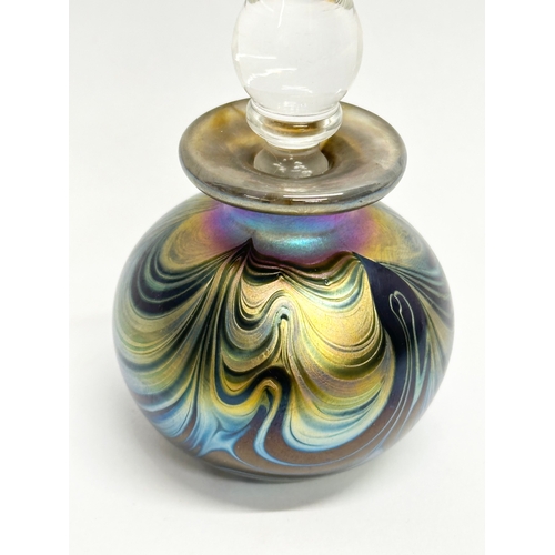 48A - An iridescent Irish art glass scent bottle. Probably by Sean O’Donoghue. 13.5cm