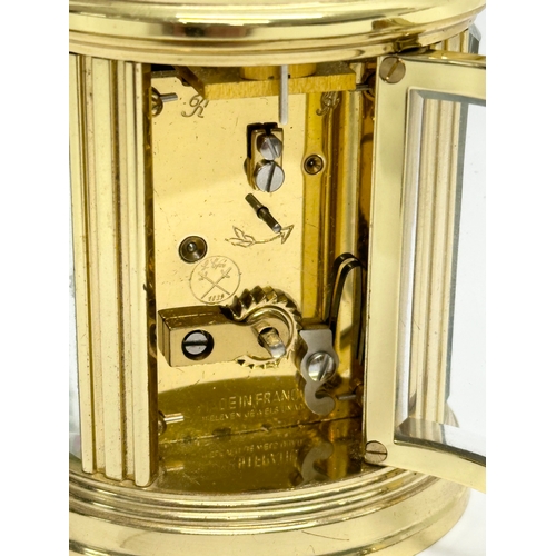 301 - A small L'Epee French brass carriage clock. With key and 5 bevelled glass panels. 9cm.