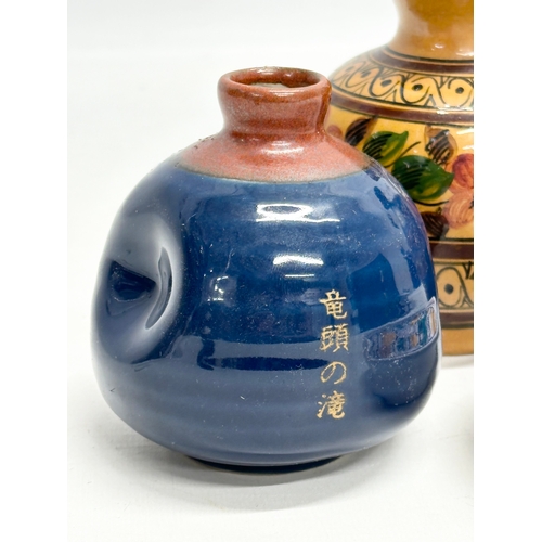 747 - A collection of pottery. A Mejias Polonio iridescent glazed bottle vase 15cm. A signed Chinese glaze... 