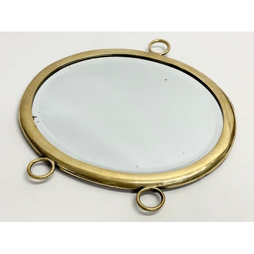 690 - A Late 19th/Early 20th Century brass framed tray/mirror, with bevelled glass. 33x35cm