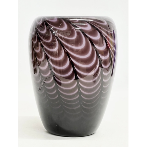 699 - A Late 20th Century peacock purple swirl vase. 15x21cm.