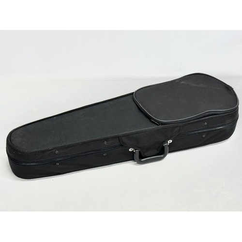 719 - A Gear 4 Music violin in case.