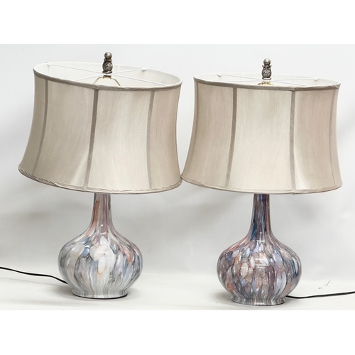 715 - A pair of large decorative tin table lamps. 45x68cm.