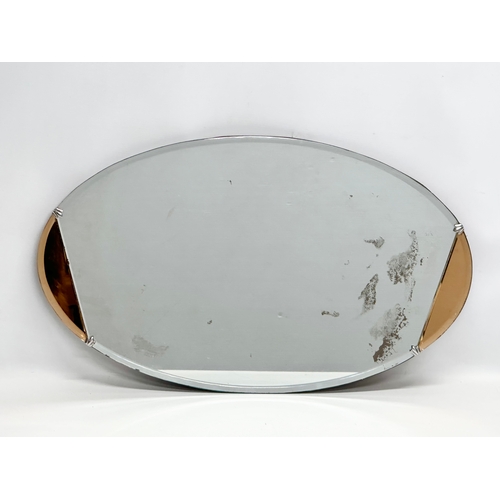 348 - A 1930’s Art Deco stained glass mirror, with bevelled glass. 68.5x41cm.