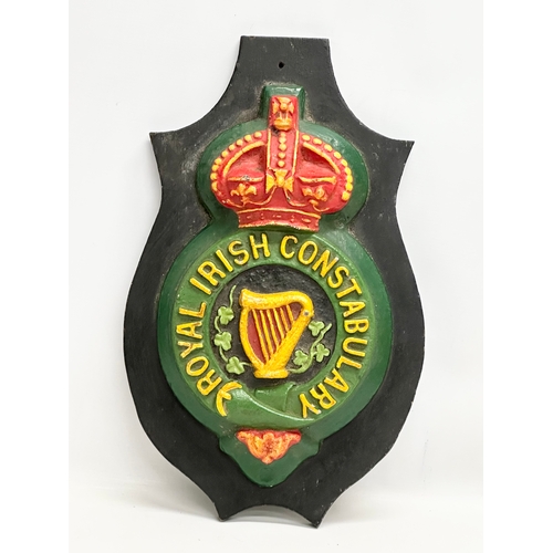 701 - A large Mid/Late 20th Century reproduction Royal Irish Constabulary wall plaque. 29x50cm