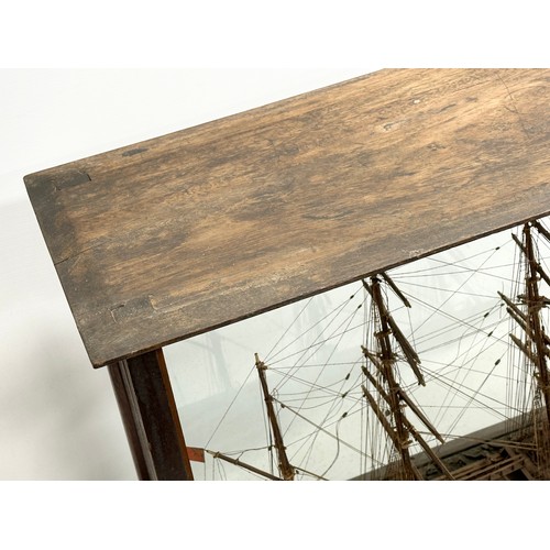 208 - A large 19th Century model ship on display case. 73x30.5x53cm.