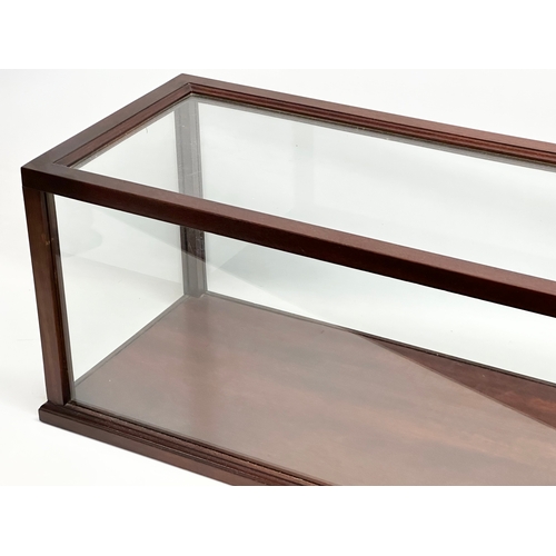 349 - A large mahogany framed display case. 93x32x31cm