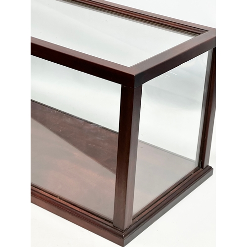 349 - A large mahogany framed display case. 93x32x31cm