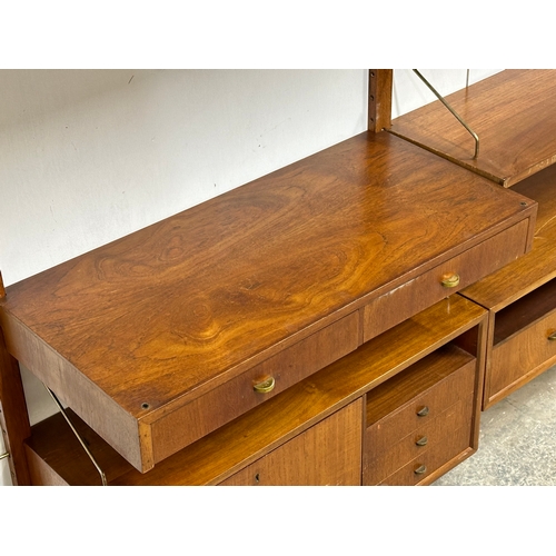 804 - Poul Cadovius. A Danish Mid Century teak “Royal System” modular wall unit. Designed by Poul Cadovius... 