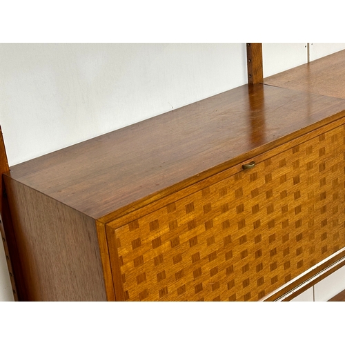 804 - Poul Cadovius. A Danish Mid Century teak “Royal System” modular wall unit. Designed by Poul Cadovius... 