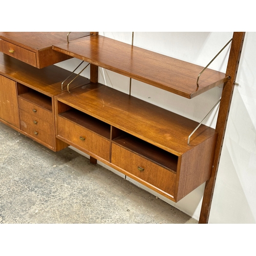 804 - Poul Cadovius. A Danish Mid Century teak “Royal System” modular wall unit. Designed by Poul Cadovius... 