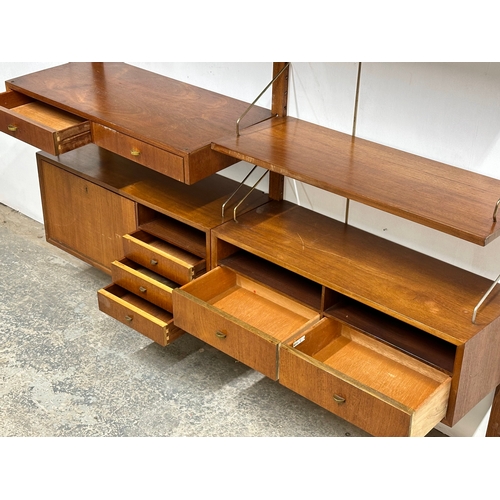 804 - Poul Cadovius. A Danish Mid Century teak “Royal System” modular wall unit. Designed by Poul Cadovius... 