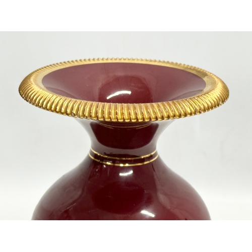 749 - A 1950’s Italian gilt porcelain vase by Fiorentine. 12x21.5cm.