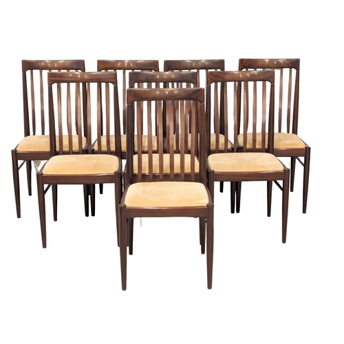 1053 - A Henry Walter Klein (H. W. Klein). A Danish Mid Century rosewood extending dining table and 8 chair... 