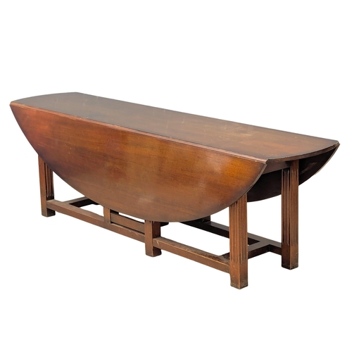 1069 - A very large mahogany hunt / wake table. Extended 154x244.5x75cm(7)