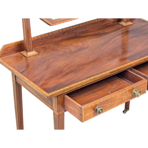 1099 - An Early 20th Century Sheraton Revival inlaid mahogany dressing table on square tapered legs. 104.5x... 