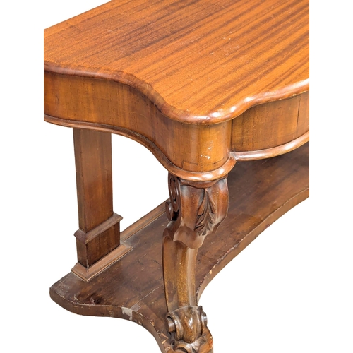 1064 - A Late 19th Century mahogany duchess hall table on Cabriole legs. 105x46x70cm(7)