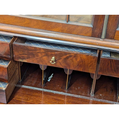 1078 - A large George III mahogany bureau bookcase with astragal glazed doors. Circa 1800. 99x56x228cm (8)