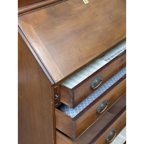 1078 - A large George III mahogany bureau bookcase with astragal glazed doors. Circa 1800. 99x56x228cm (8)