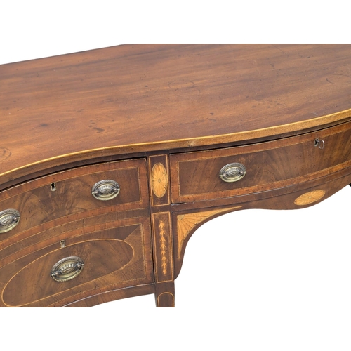 1083 - A Late 18th Century, George III, inlaid mahogany sideboard in the Sheraton style on square tapering ... 