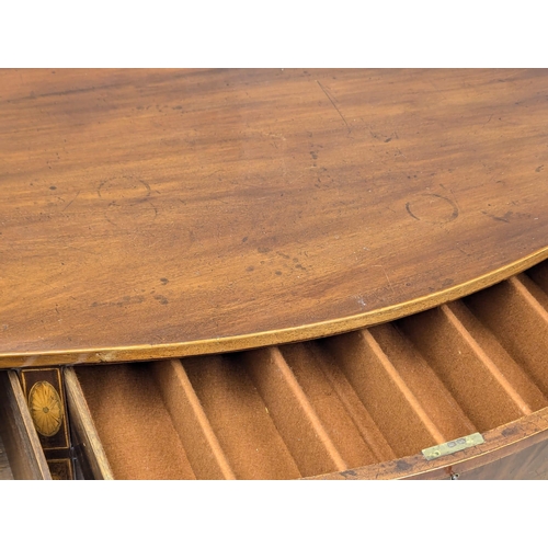 1083 - A Late 18th Century, George III, inlaid mahogany sideboard in the Sheraton style on square tapering ... 