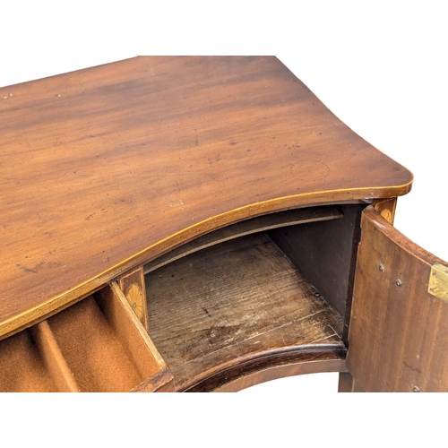 1083 - A Late 18th Century, George III, inlaid mahogany sideboard in the Sheraton style on square tapering ... 