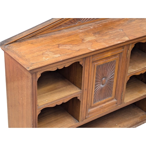 1076 - A Late Victorian low walnut cabinet with shelves and cupboard door. Circa 1890s. 111x34x87.5cm.(9)