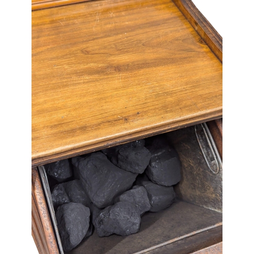 1066 - A Late Victorian walnut coal cabinet with liner.(7)