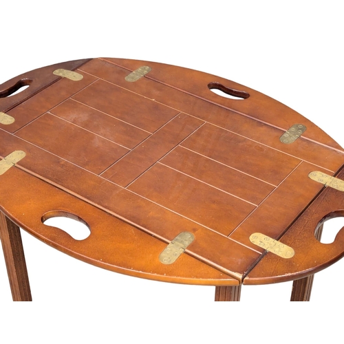 1081 - A butler's tray on stand / coffee table. 72x46x66cm(11)