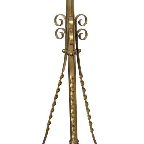 1097 - A large Early 20th Century brass telescopic standard lamp on lion paw feet. 194cm(8)