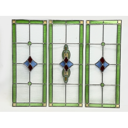 352 - A set of 3 large Early 20th Century stained glass panels. 39x98cm