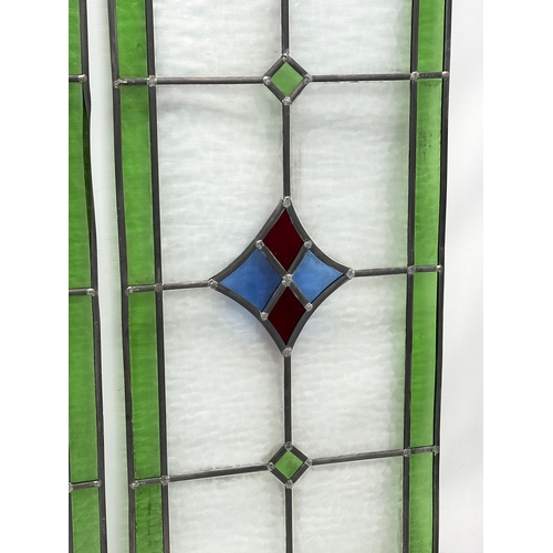 352 - A set of 3 large Early 20th Century stained glass panels. 39x98cm