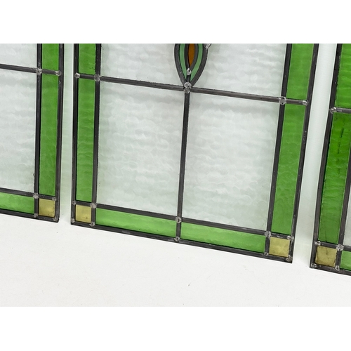 352 - A set of 3 large Early 20th Century stained glass panels. 39x98cm