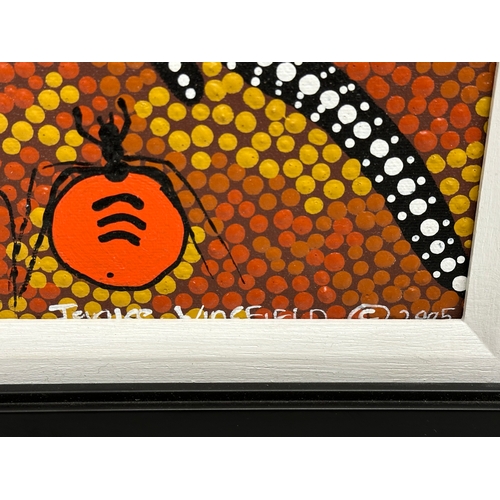 694 - A signed Aboriginal oil painting. 47x14cm. Frame 61x38cm