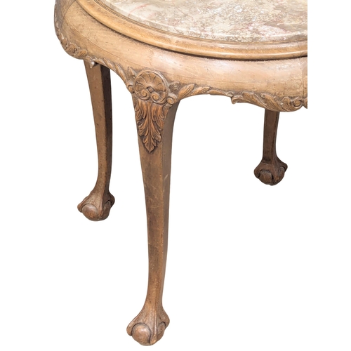 1005 - An Early 20th Century mahogany marble top side table on Ball & Claw feet. 59x62cm (3)