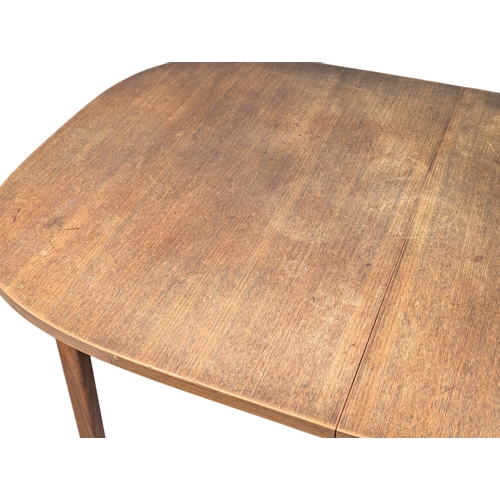 1010 - A Mid Century teak dining table. With leaf. 150.5x100x73cm(4)