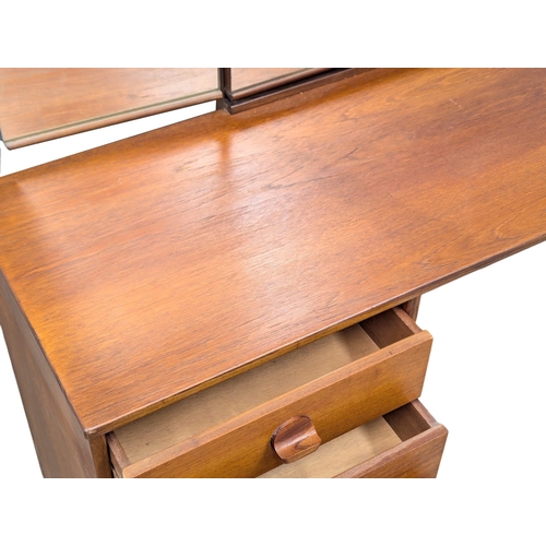 1019 - A Mid Century teak 'Cantata' dressing table designed by John & Sylvia Reid for Stag. 151x44x127.5cm.... 