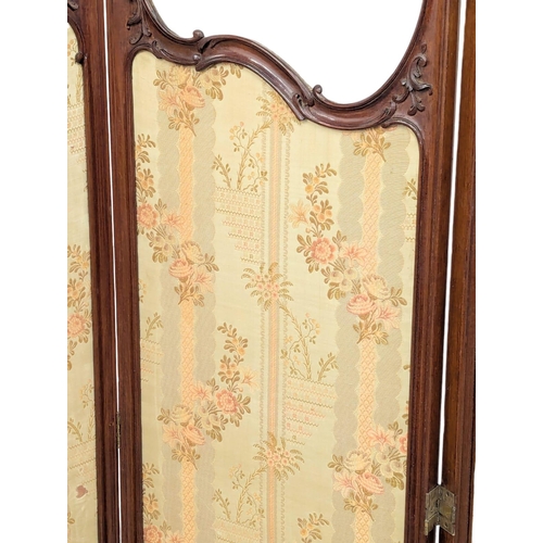 1027 - A Late 19th Century / Early 20th Century mahogany framed screen. 142cm